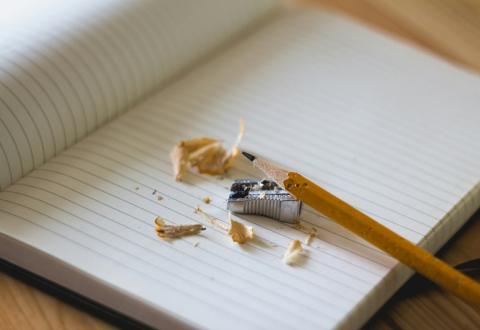 Stock photo with a notebook and a pencil.